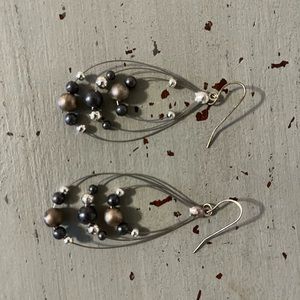 Dangle earrings with silver beads.